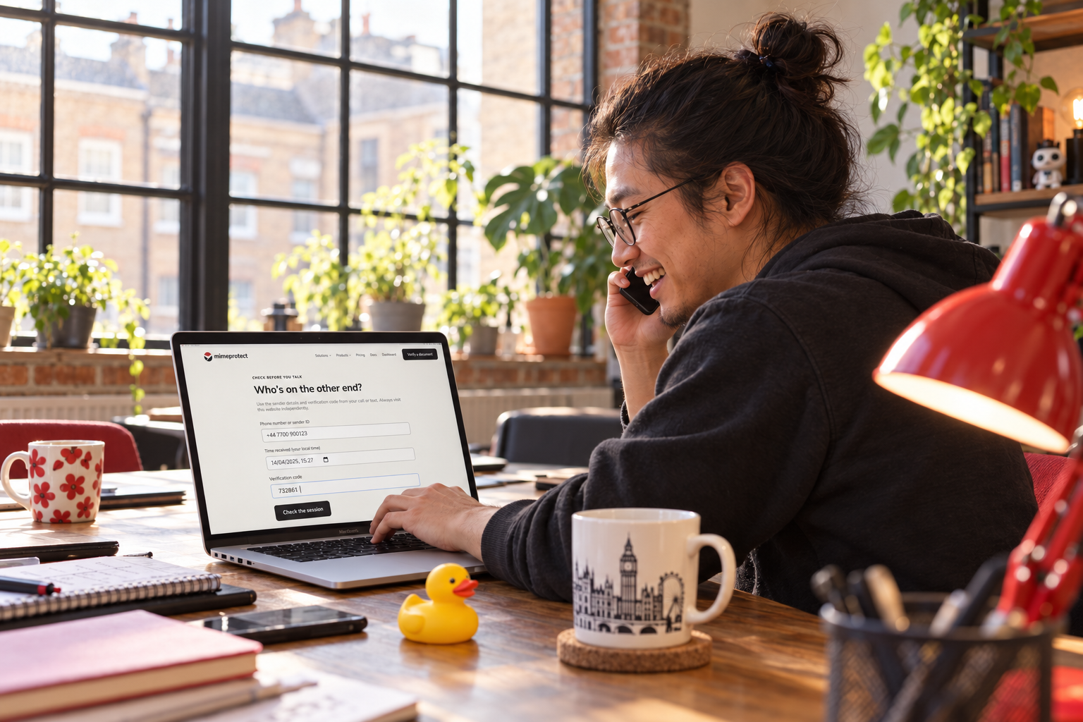 A customer checking a caller’s verification code in MimeProtect while speaking on the phone