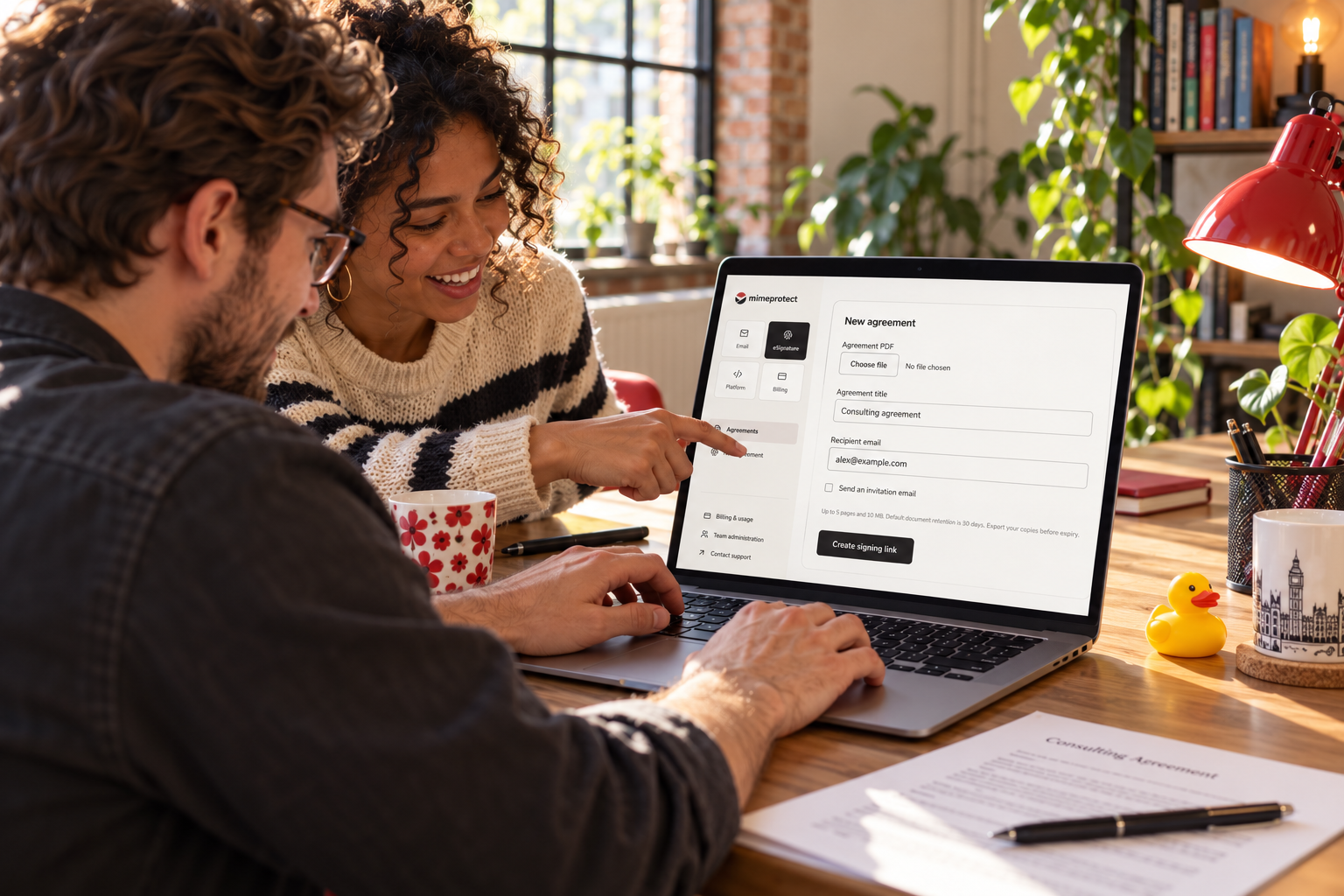 A team preparing an agreement for signature